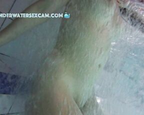 NEW! This young girl discovered the floor bubbler in the sauna pool and uses it to masturbate.
