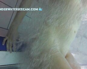 NEW! This young girl discovered the floor bubbler in the sauna pool and uses it to masturbate.