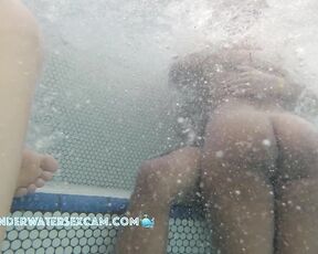 NEW! She's so horny, she'd definitely fuck me in the jacuzzi if she were alone while the voyeur's hidden camera is taping them underwater in a public nudist resort.