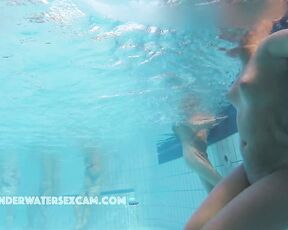 NEW! Look at the guy in the background, busily masturbating with the underwater jet while staring at the hot girl in the foreground.