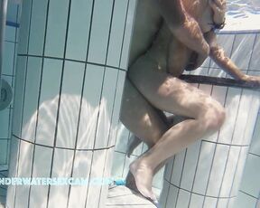 NEW! This young couple is so horny and is having sex in the crowded sauna pool, and she's also using her fingers