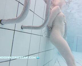 NEW! She doesn't dare to masturbate with the underwater jet, but it still arouses her, as you can tell by her nipples