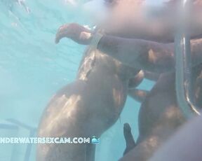 NEW! While she masturbates with the underwater jet from behind, he rubs her pierced clitoris with his hard dick