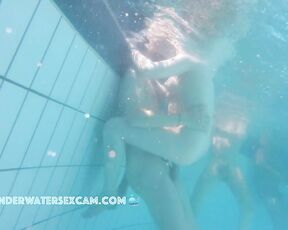 NEW! While a young couple is having sex, a perverted voyeur in the background starts masturbating with the underwater jet.