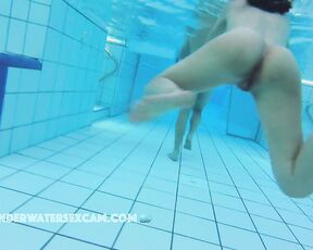 NEW! The view here is especially beautiful because the cameraman manages to film her while she's swimming