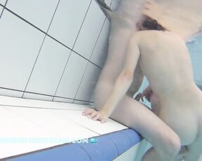 NEW! I'm sure she can feel his erection, so she might as well use him for a quick underwater fuck.